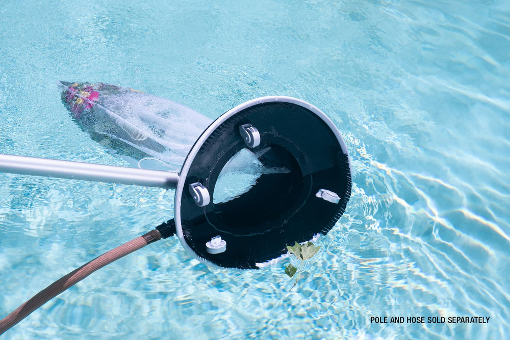 Poolmaster vacuum attached to hose in pool conveying fast leaf removal