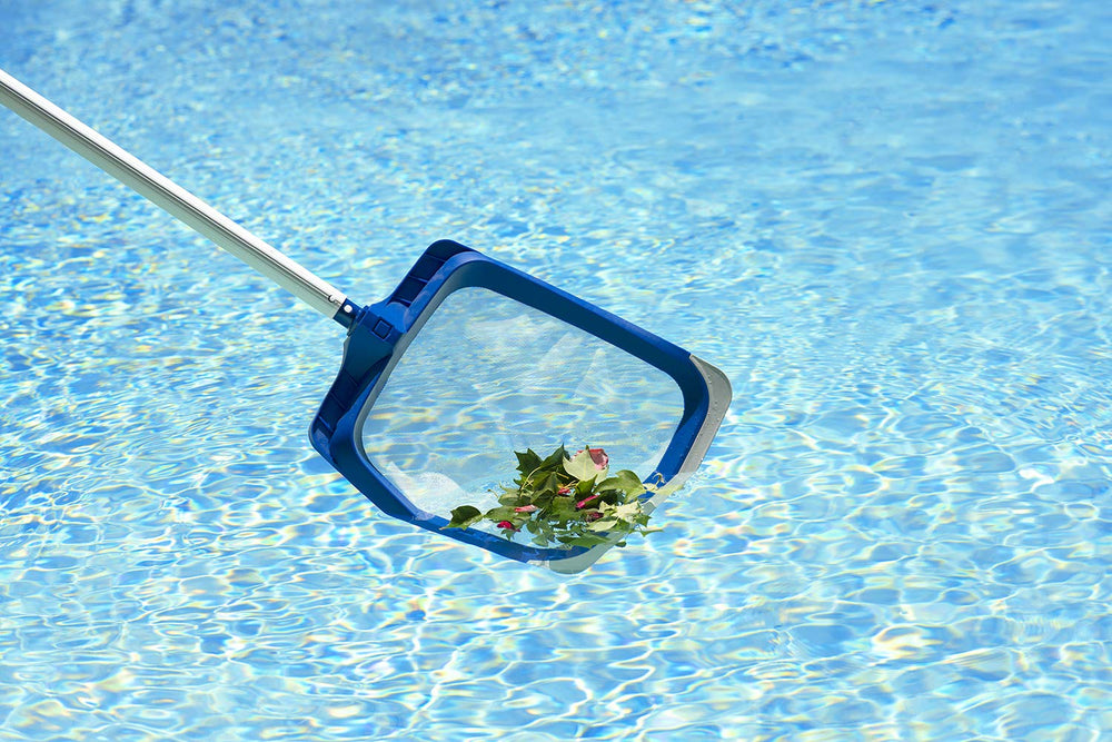 Poolmaster skimmer next to ruler to show scale and ergonomic size