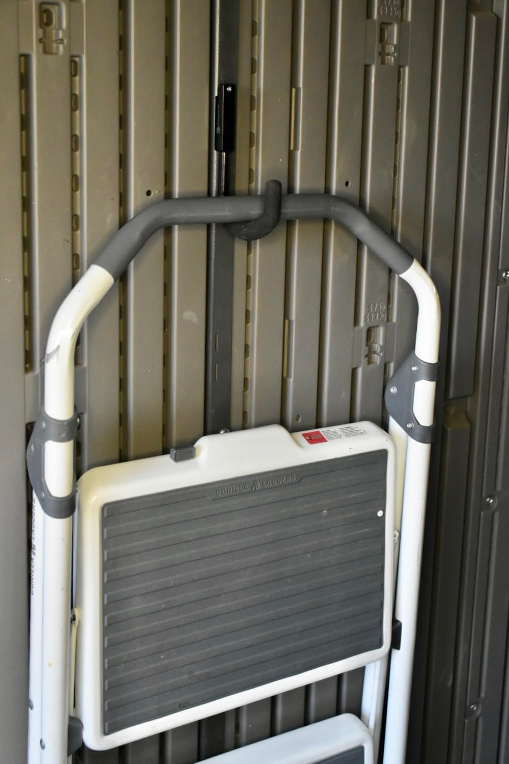 Pop's Parts Plus metal hook supporting garden tools to maximize shed space