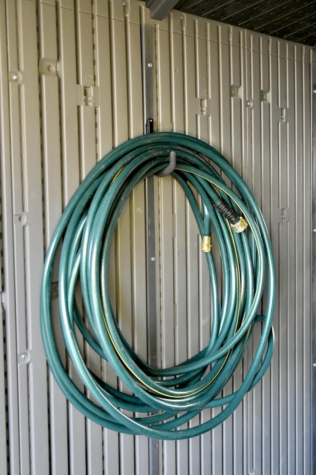 Pop's Parts Plus hook installed in Lifetime Shed vertical channel for stable storage