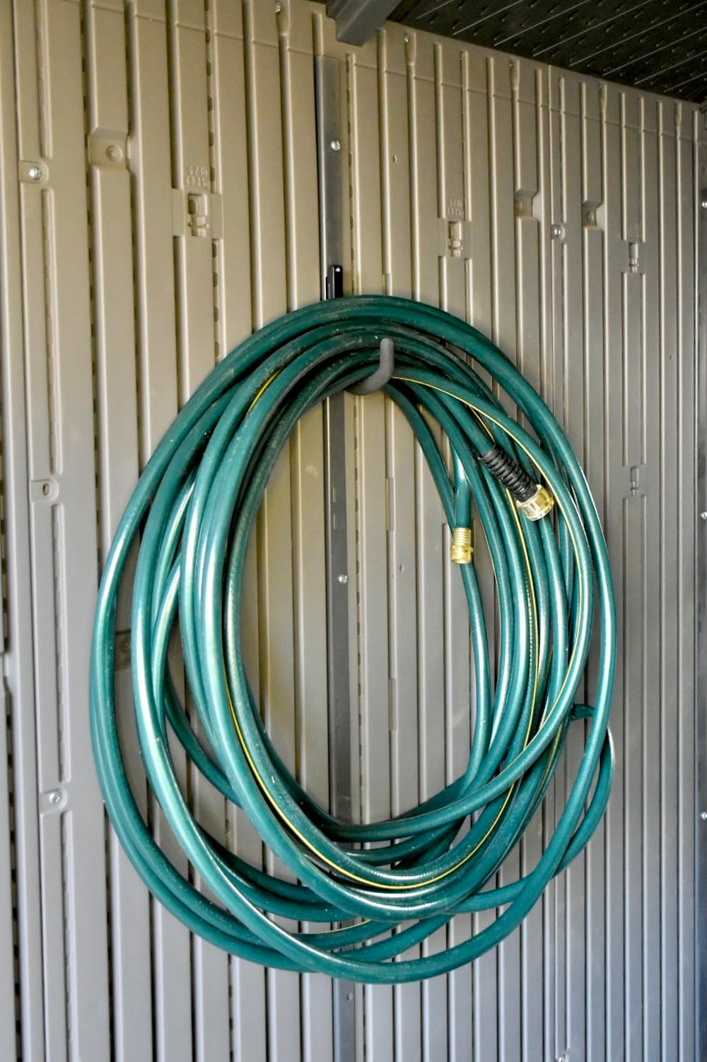 Pop's Parts Plus hook installed in Lifetime Shed vertical channel for stable storage