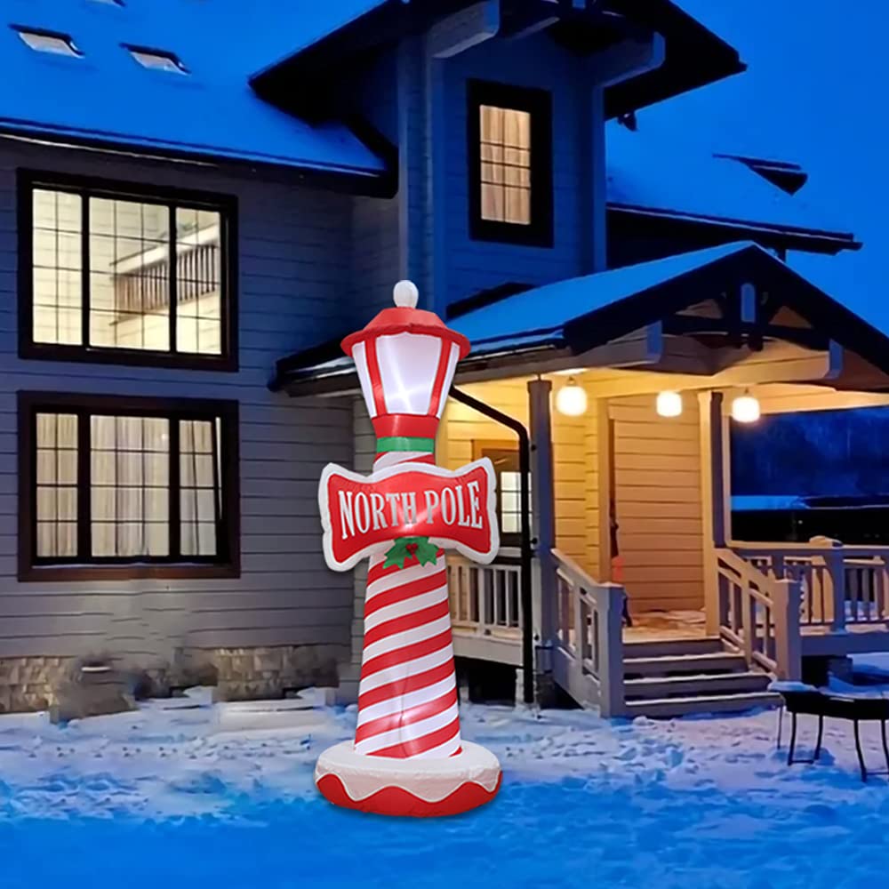 Poptrend lighthouse in a decorated yard creating holiday ambiance