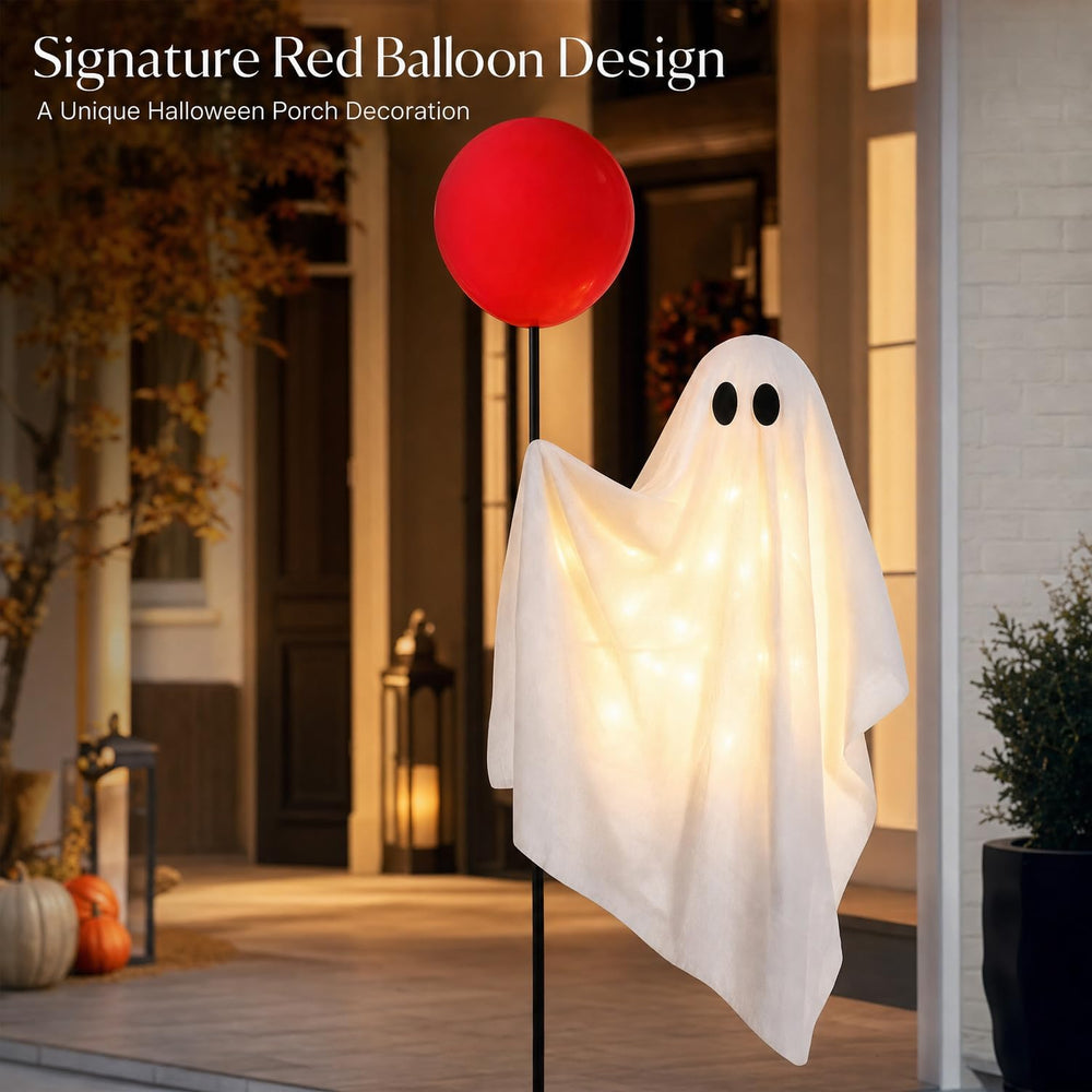 Power Your Lawn ghost lit at night enhancing Halloween atmosphere outdoors