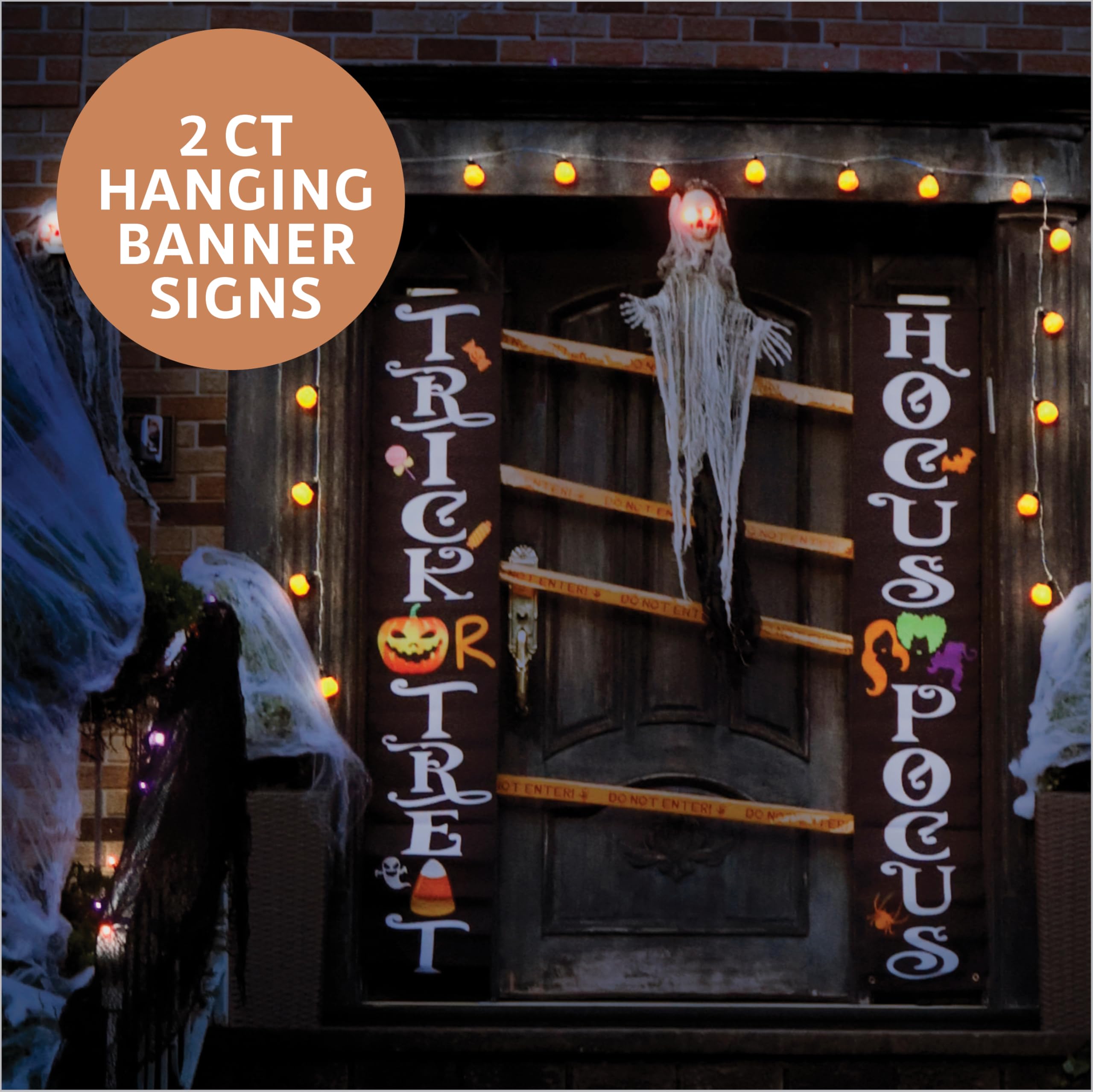 Premium Innovations nighttime yard setup lit up for dramatic Halloween curb appeal