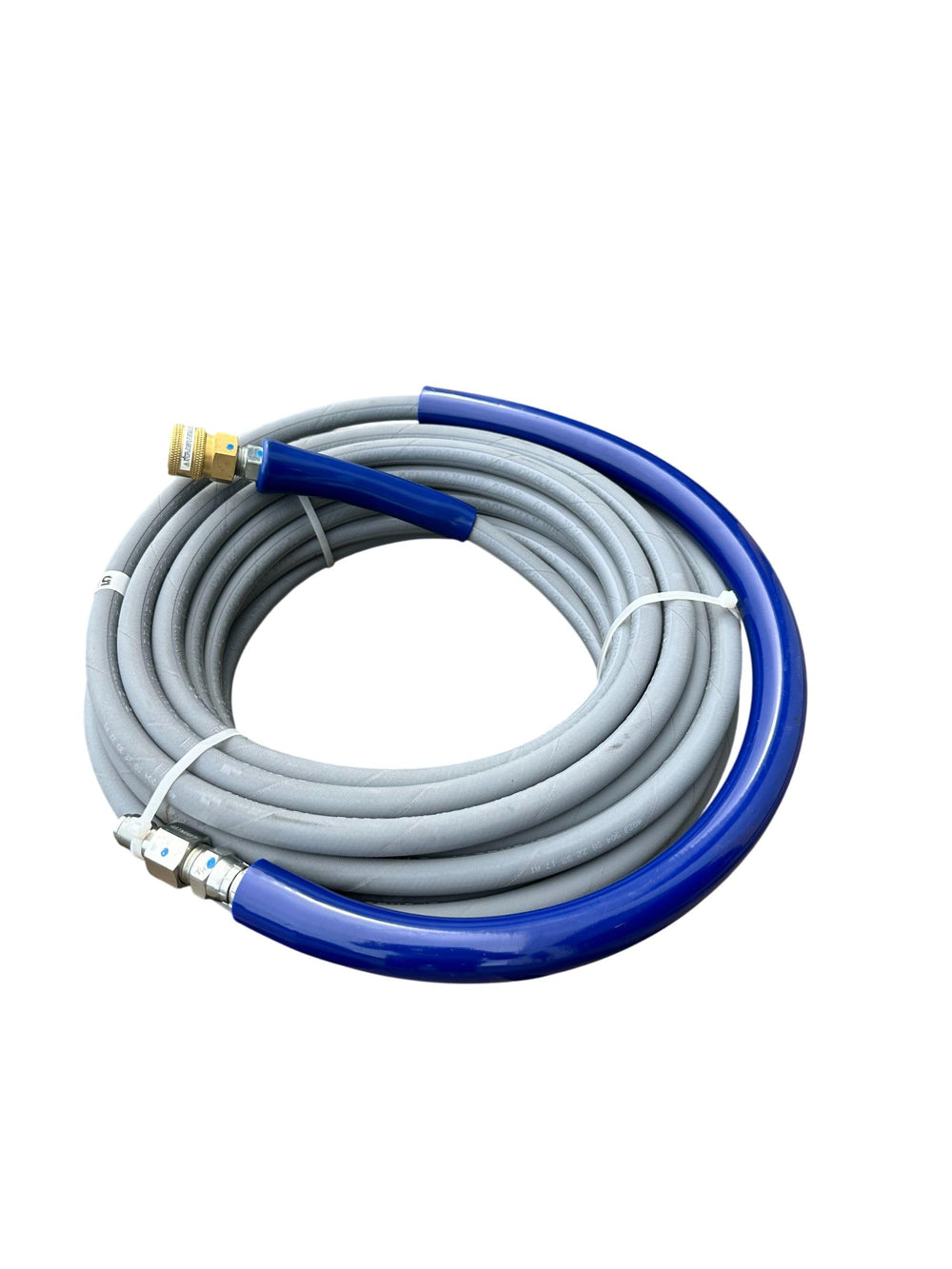 Pressure-Pro hose coiled beside a tape measure illustrating 50 ft length and easy storage advantage