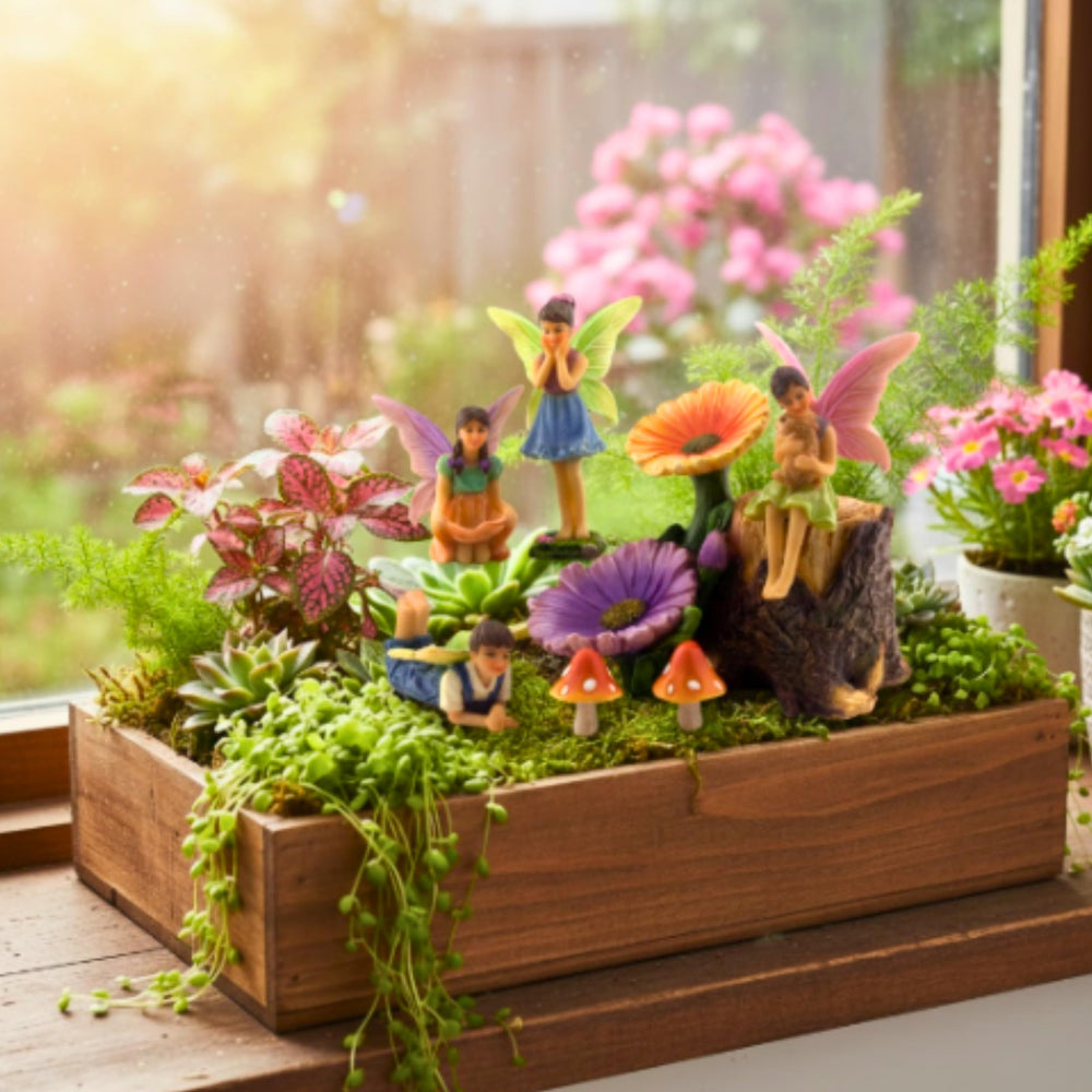PRETMANNS group of fairy figurines arranged for whimsical garden storytelling