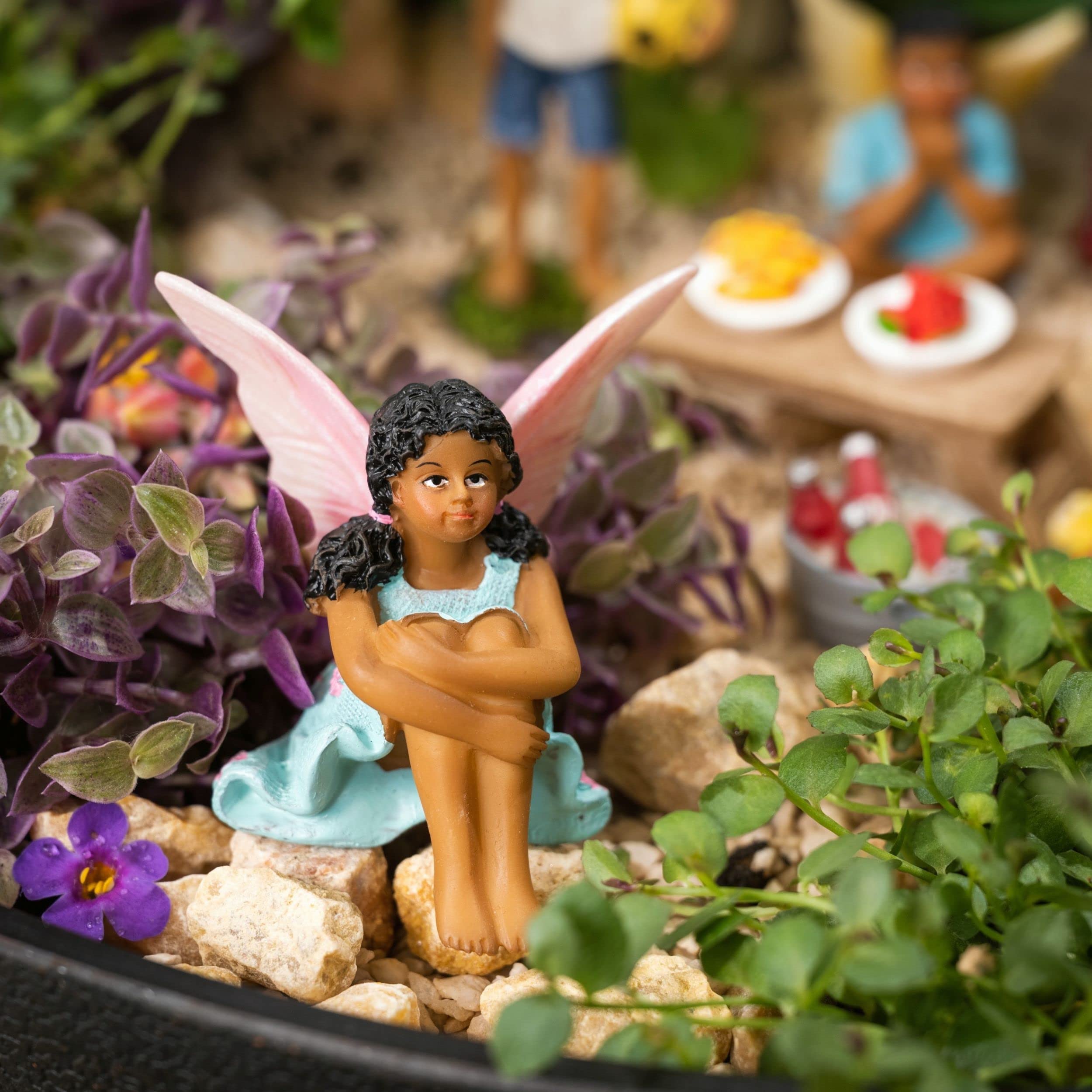 PRETMANNS wide shot of miniature scene creating a whimsical focal point