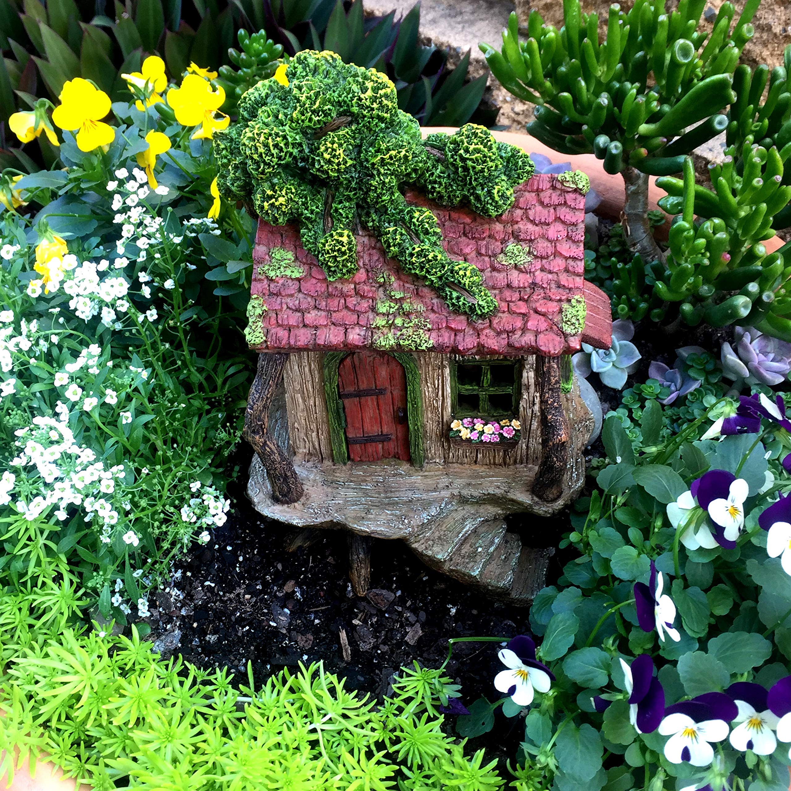 PRETMANNS treehouse placed in planter demonstrating integration with live plants