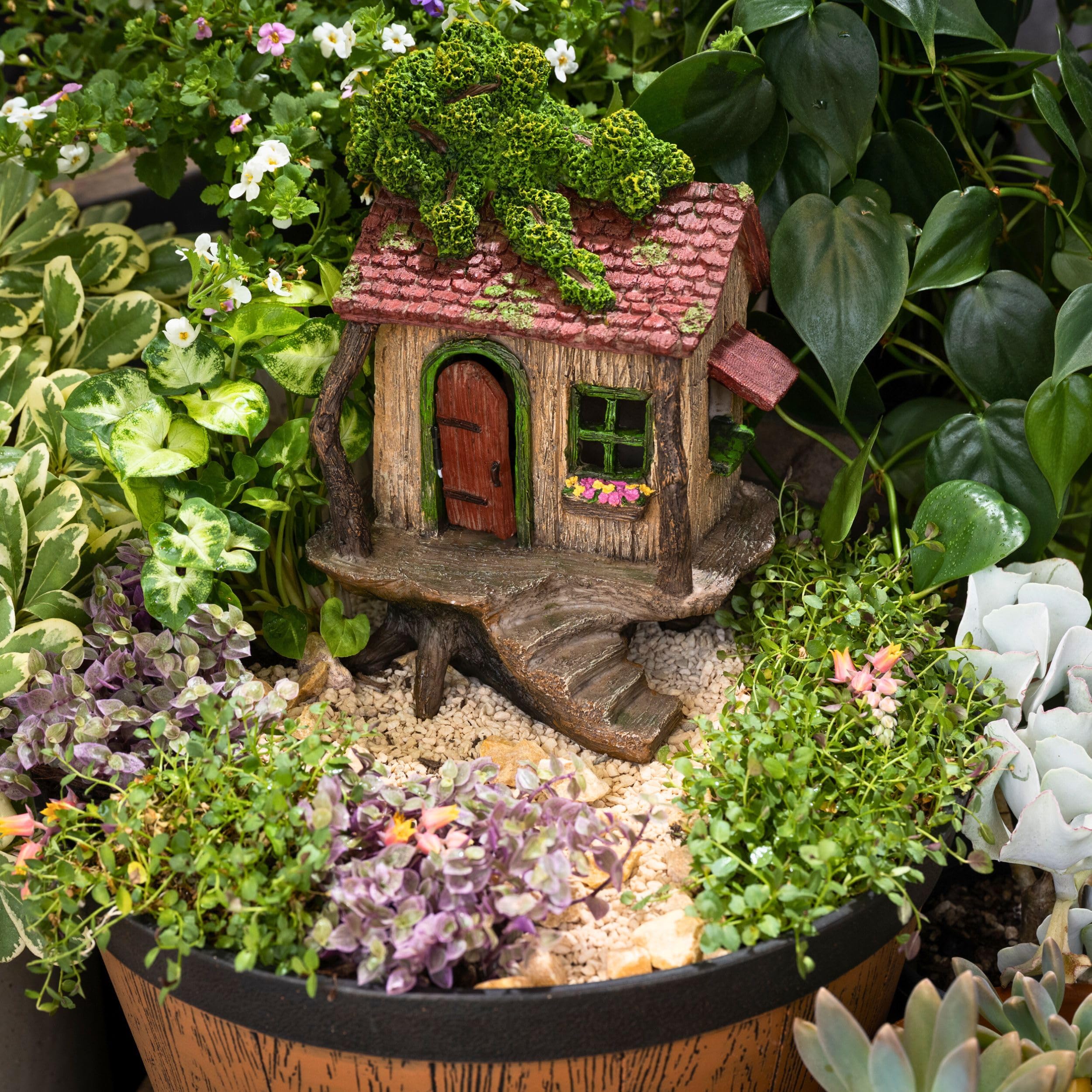 PRETMANNS treehouse beside ruler showing 9-inch height for size clarity