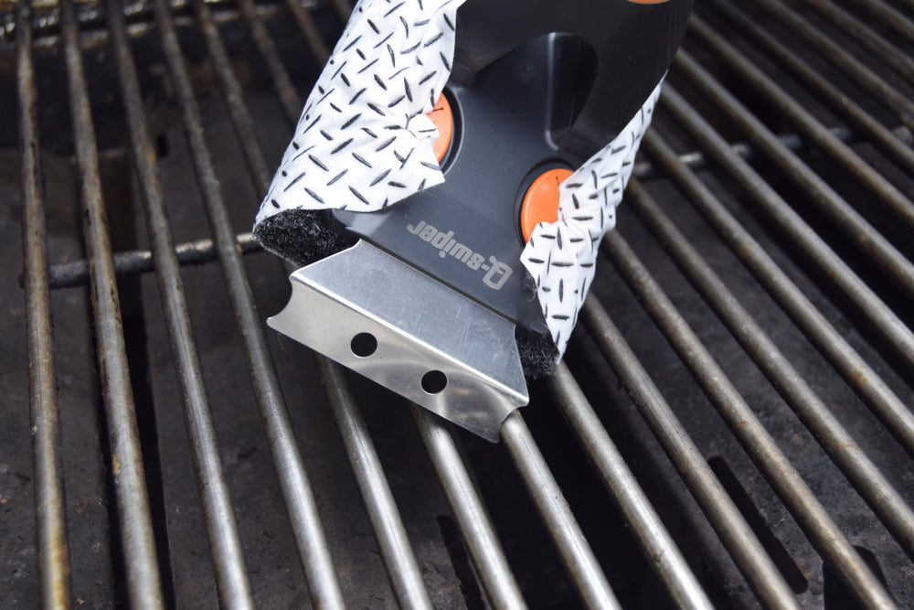Proud Grill Company hanging Q-Swiper XL stored on a hook saving space in grill area