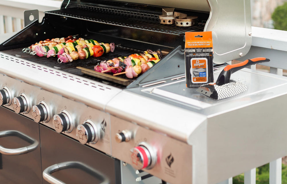 Proud Grill Company Q-Swiper XL next to a ruler showing 15-inch handle reach advantage