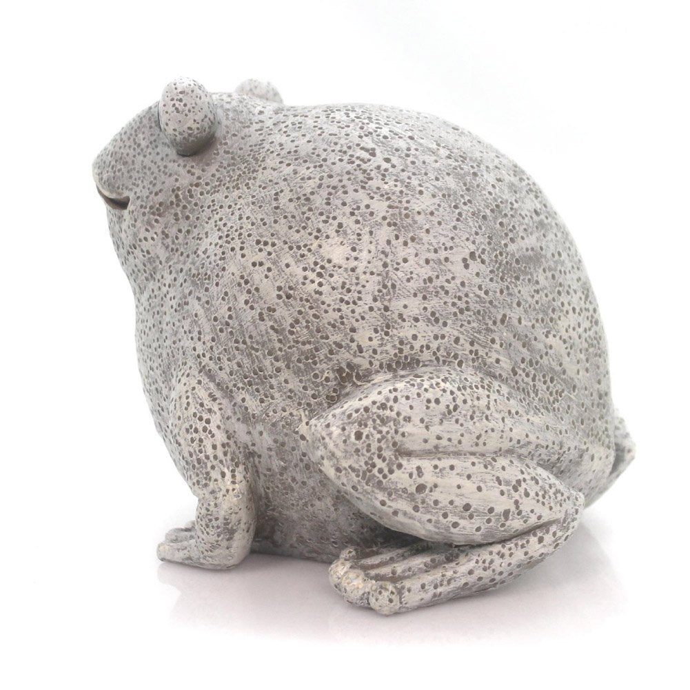 Pudgy Pals frog placed in a garden setting near potted plants, illustrating placement and curb appeal