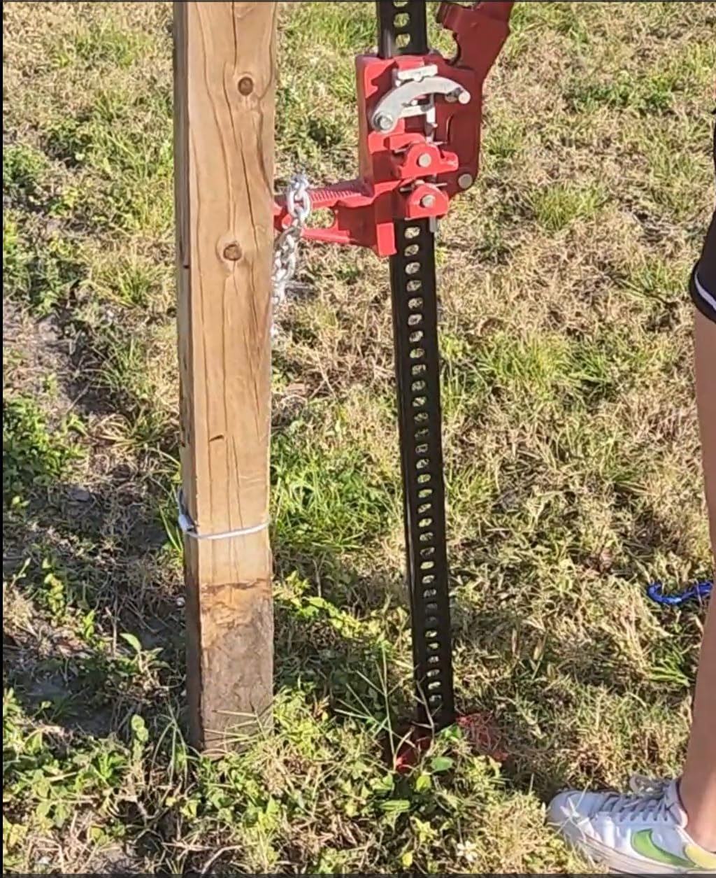 Pull A Post next to a ruler showing compact size and lightweight portability