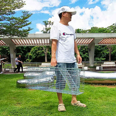 PULOMI set outdoors with bait demonstrating humane capture and easy field use benefit