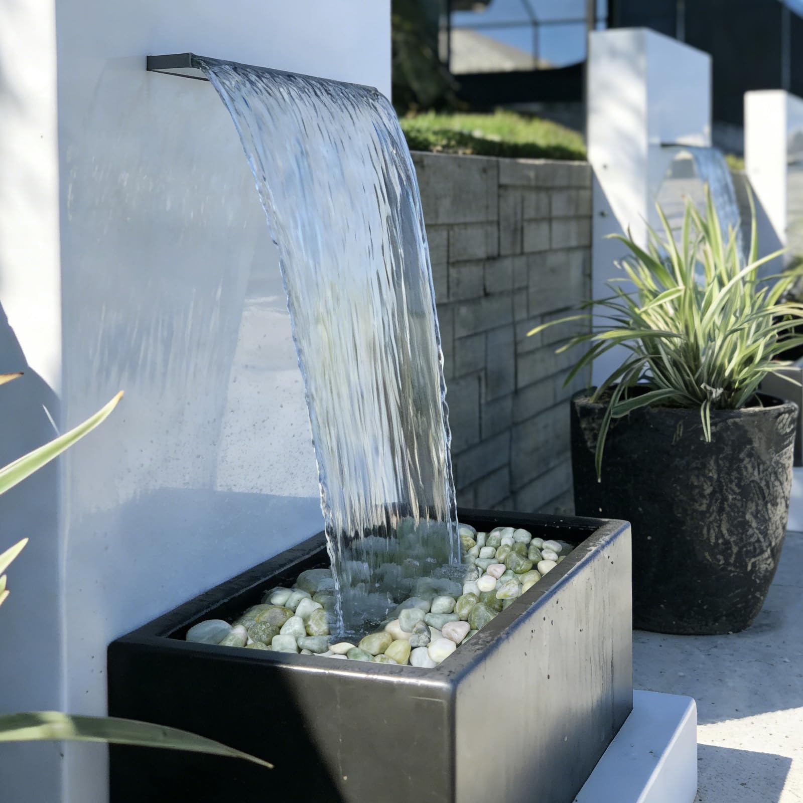 Pulovin pebbles layered in a vase for stable decorative support
