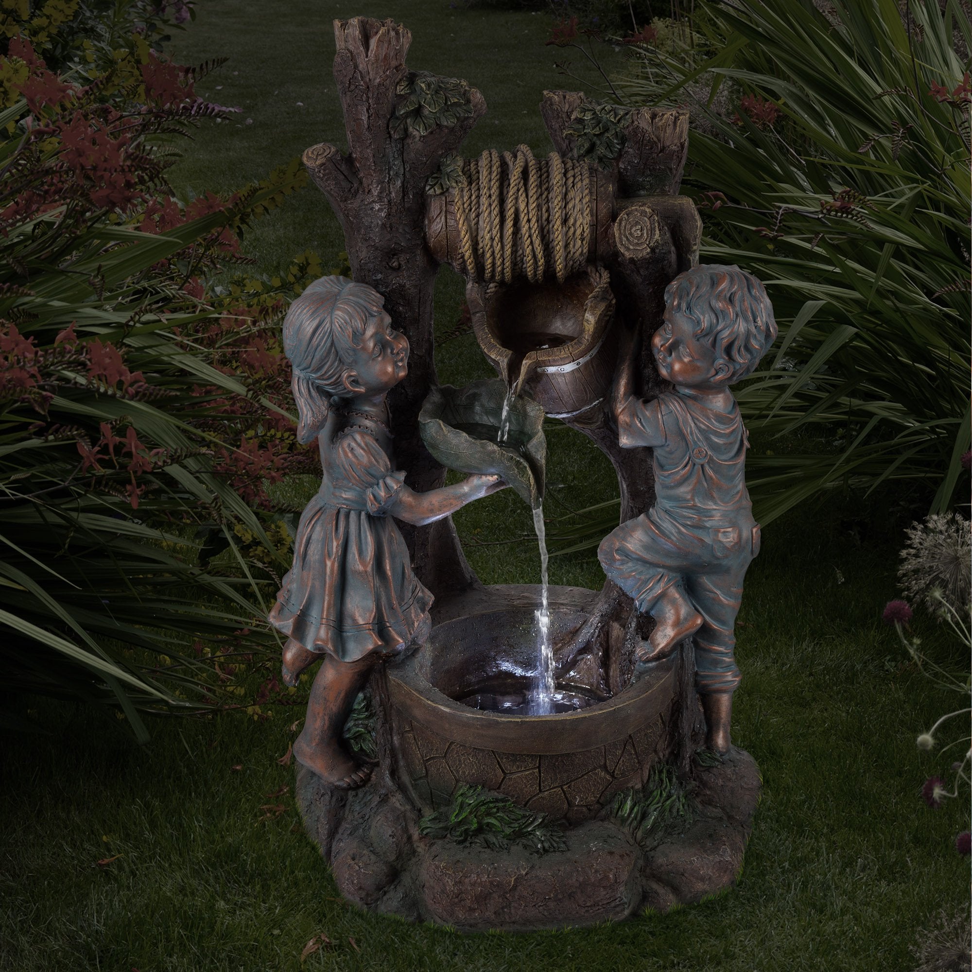 Pure Garden LED lights at night illuminating fountain and creating evening ambiance