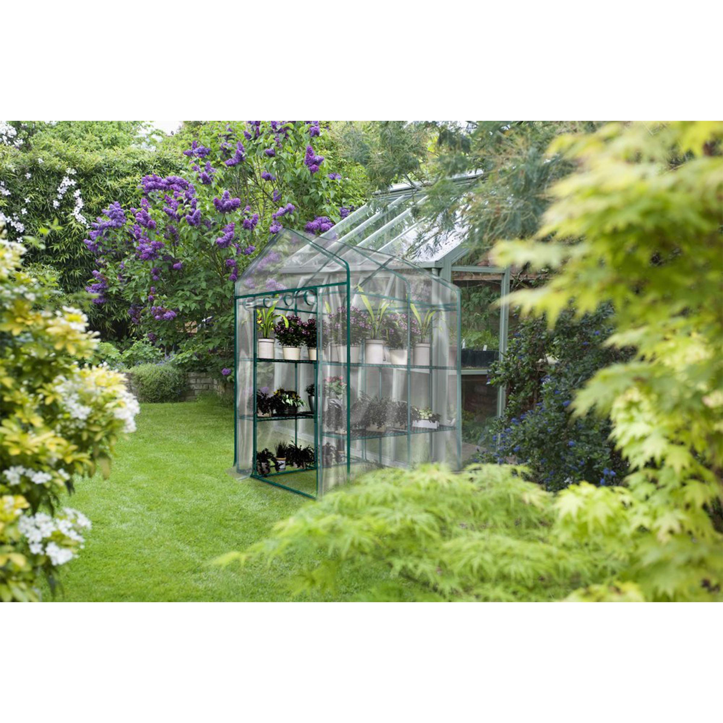 Pure Garden loaded trays and pots on shelves to illustrate organized seedling staging