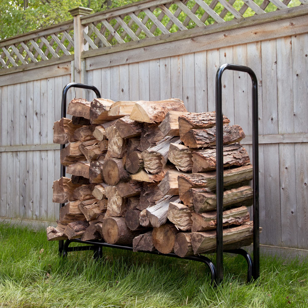 Pure Garden beside stacked logs showing scale and capacity benefit