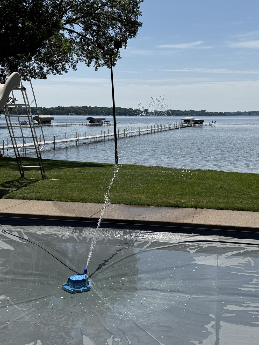 Push Industries FlexiSpout directing discharge 25 feet away to prevent pool puddles