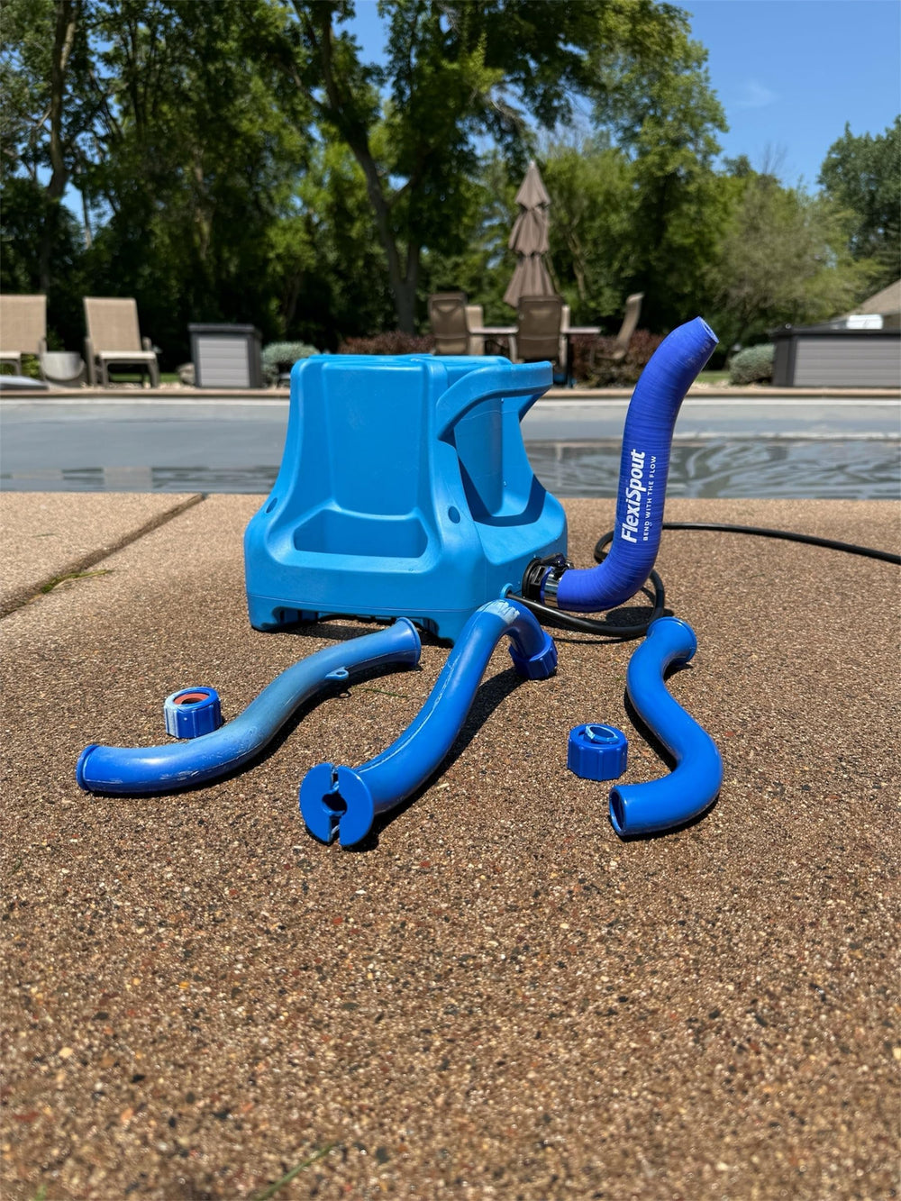 Push Industries FlexiSpout in poolside setting showing safer, organized drainage