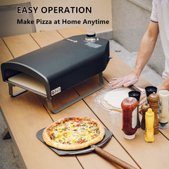 Q Pizza PS100 next to a wooden peel and baked pizza illustrating serving readiness