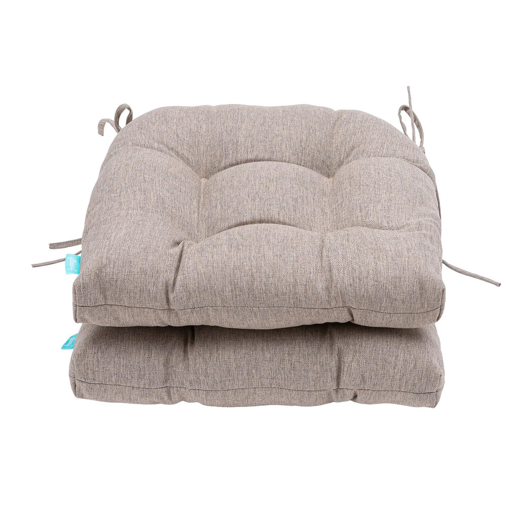 QILLOWAY cushions styled on a patio loveseat creating a comfy outdoor seating scene