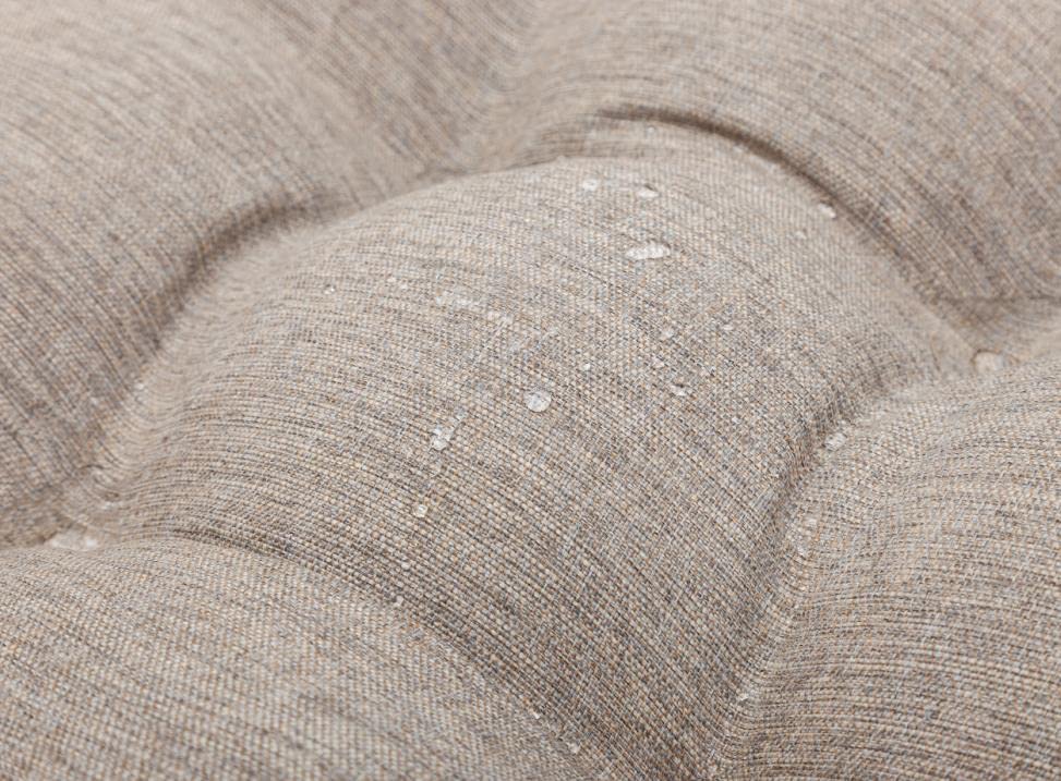 QILLOWAY cushion on a porch setting showing stylish outdoor relaxation