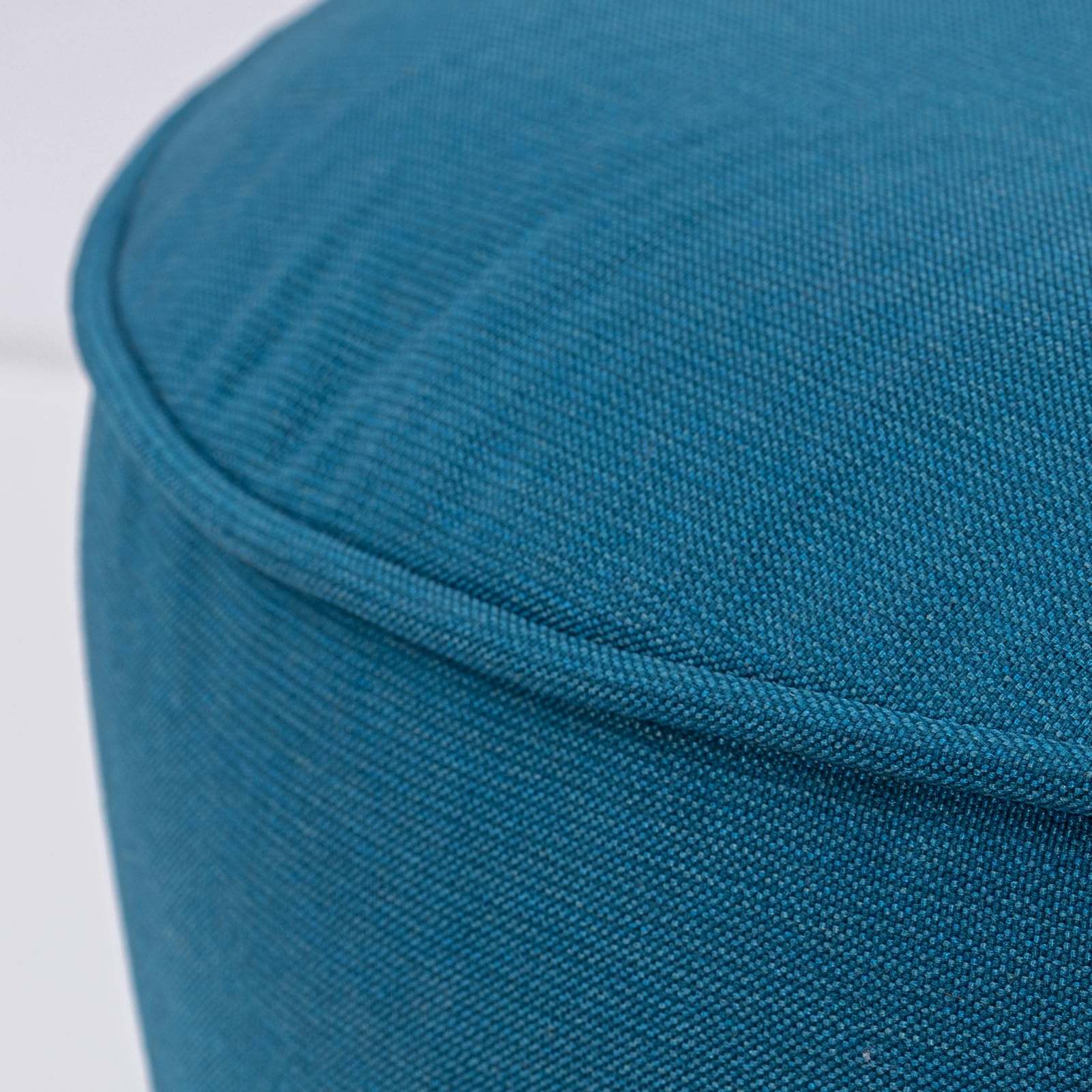 QILLOWAY ottoman next to chair showing scale and practical seating option