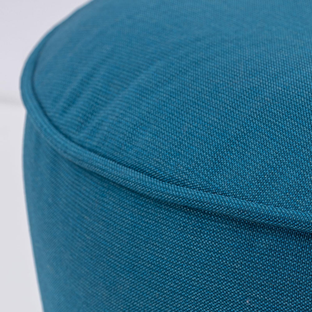 QILLOWAY ottoman next to chair showing scale and practical seating option