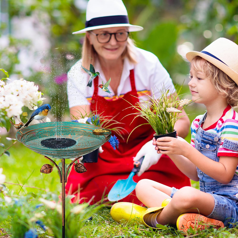 Qipade birdbath in use with visiting birds encouraging activity