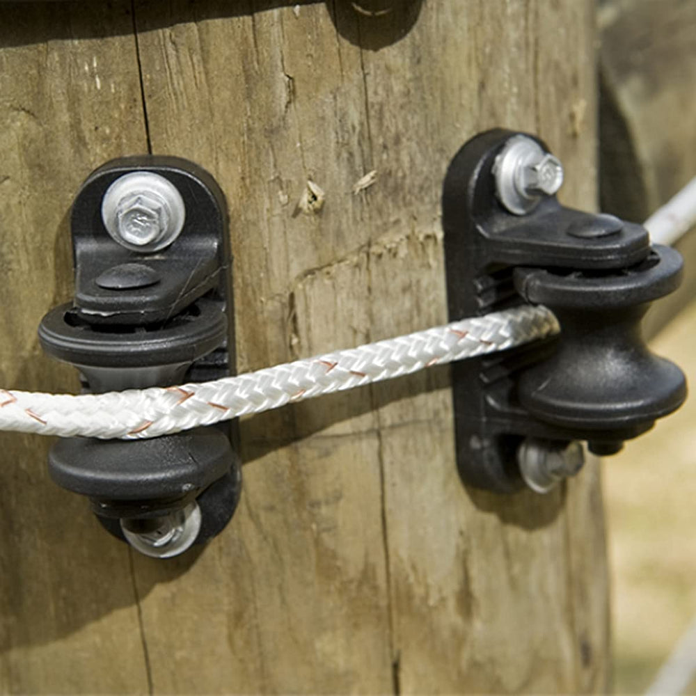 QMARK insulator beside ruler showing size and compatibility with common fence wire