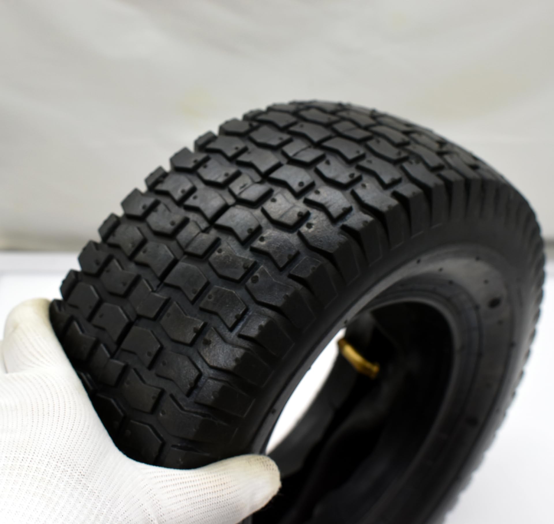 QsEzDo tire next to ruler showing accurate 13-inch diameter and correct fit benefit