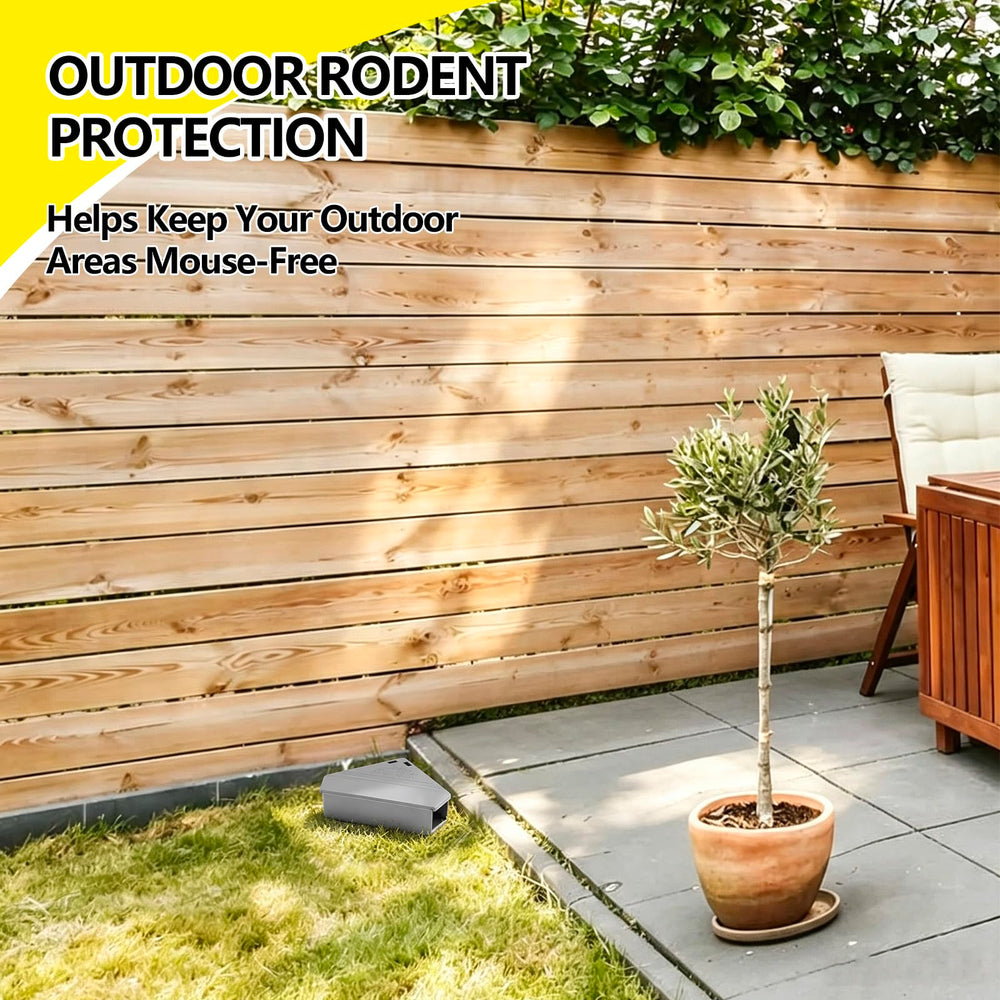 Qualirey bait station in garage setting showing outdoor durability and discreet protection