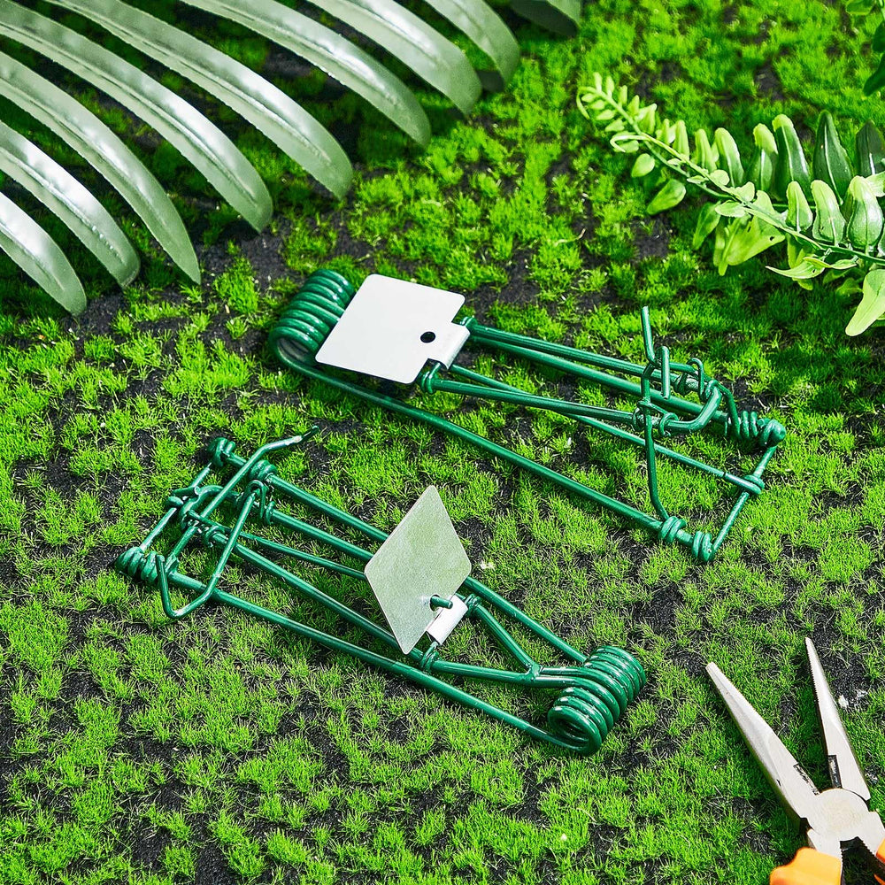 Qualirey trap next to hand for scale illustrating compact, easy placement