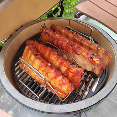 Quantfire concave turkey cradle holding a whole bird for even roasting