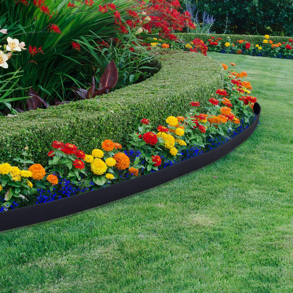 Queekay installed curved garden border around flower bed demonstrating clean edge separation
