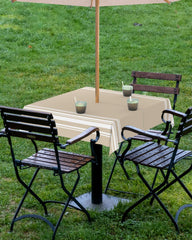 QueenKer on patio table in garden illustrating outdoor-ready protection and style