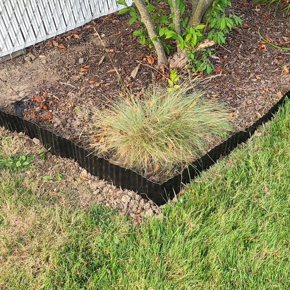 Quibbay wide landscape view with edging defining lawn and flowerbed