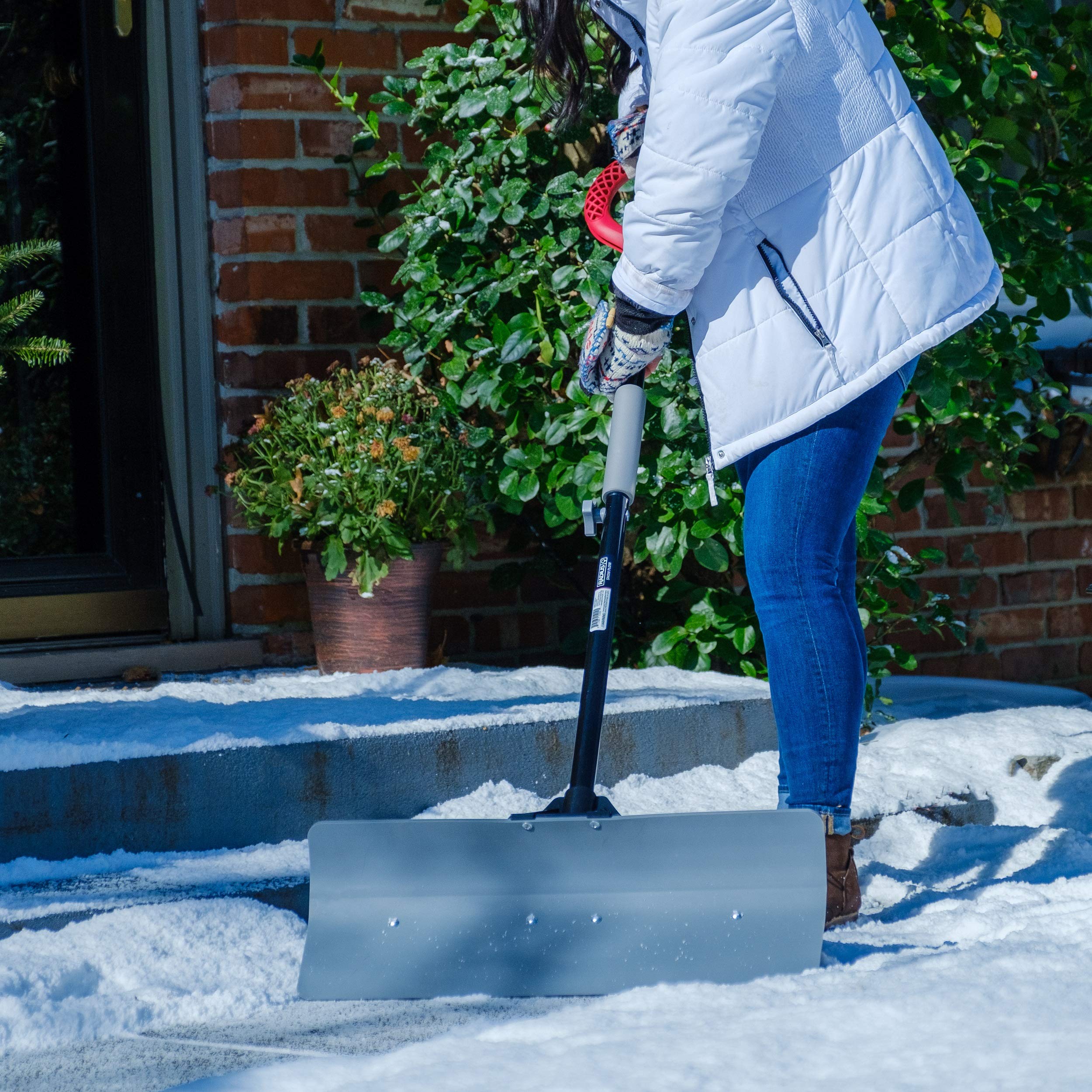 Radius Garden shovel in use pushing snow quickly across a driveway