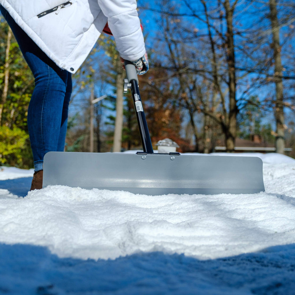 Radius Garden shovel next to doorway showing 24-inch scale for efficient clearing