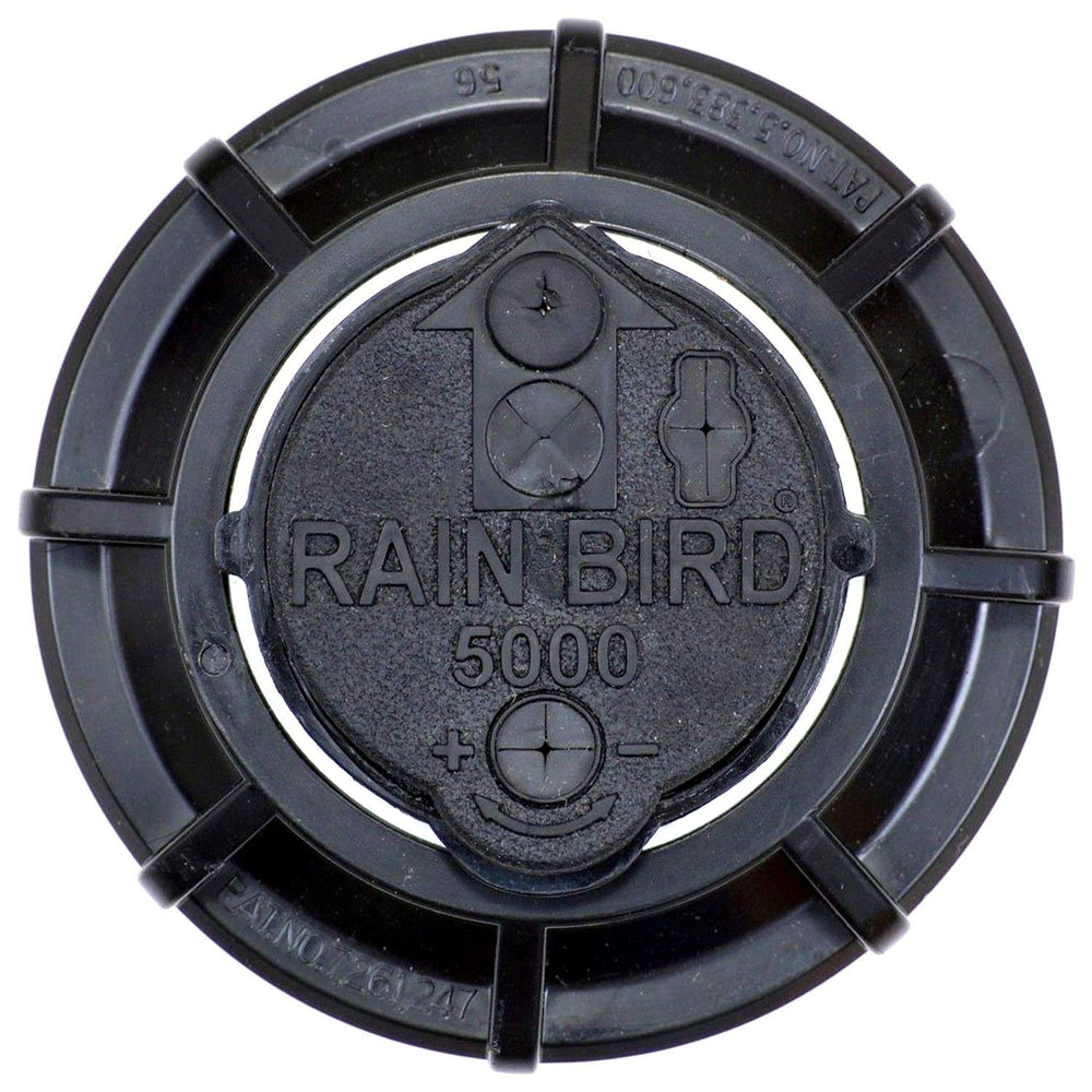 Rain Bird 4-inch pop-up height beside a ruler showing proper clearance for mowing