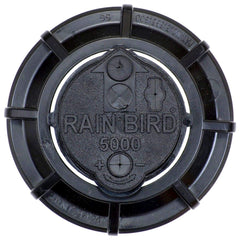 Rain Bird 4-inch pop-up height beside a ruler showing proper clearance for mowing