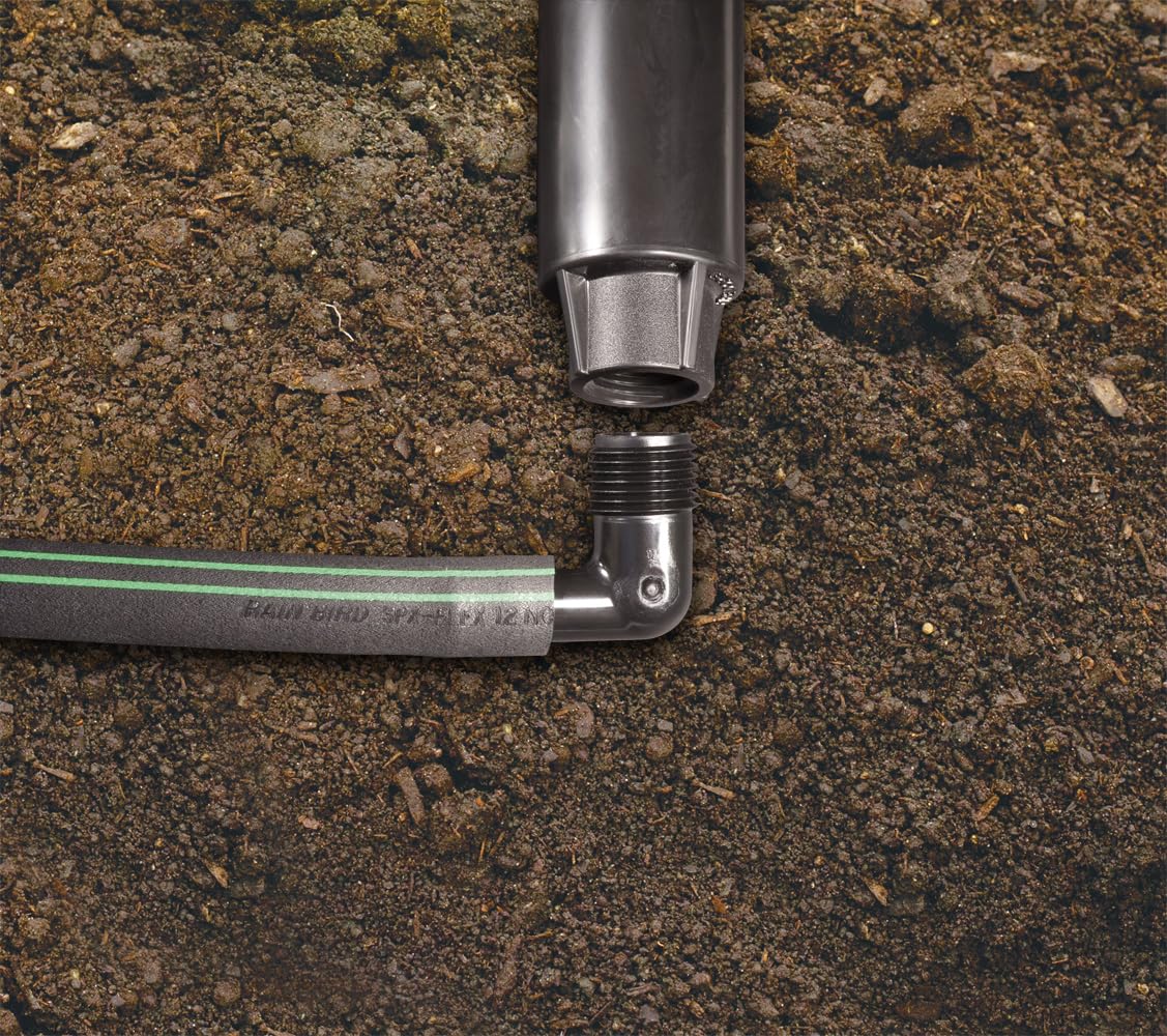 Rain Bird EZ Pipe beside tape measure showing 100-foot scale and coverage