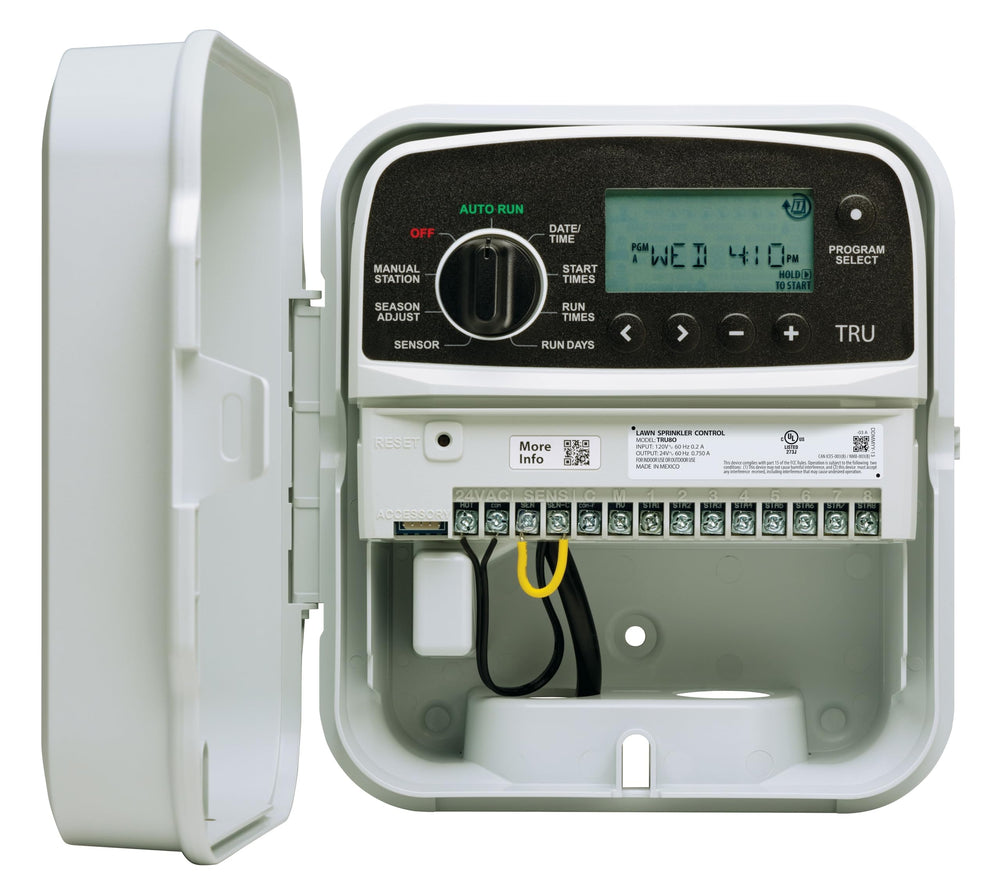 Rain Bird TRU8O next to a ruler illustrating compact size and installation footprint
