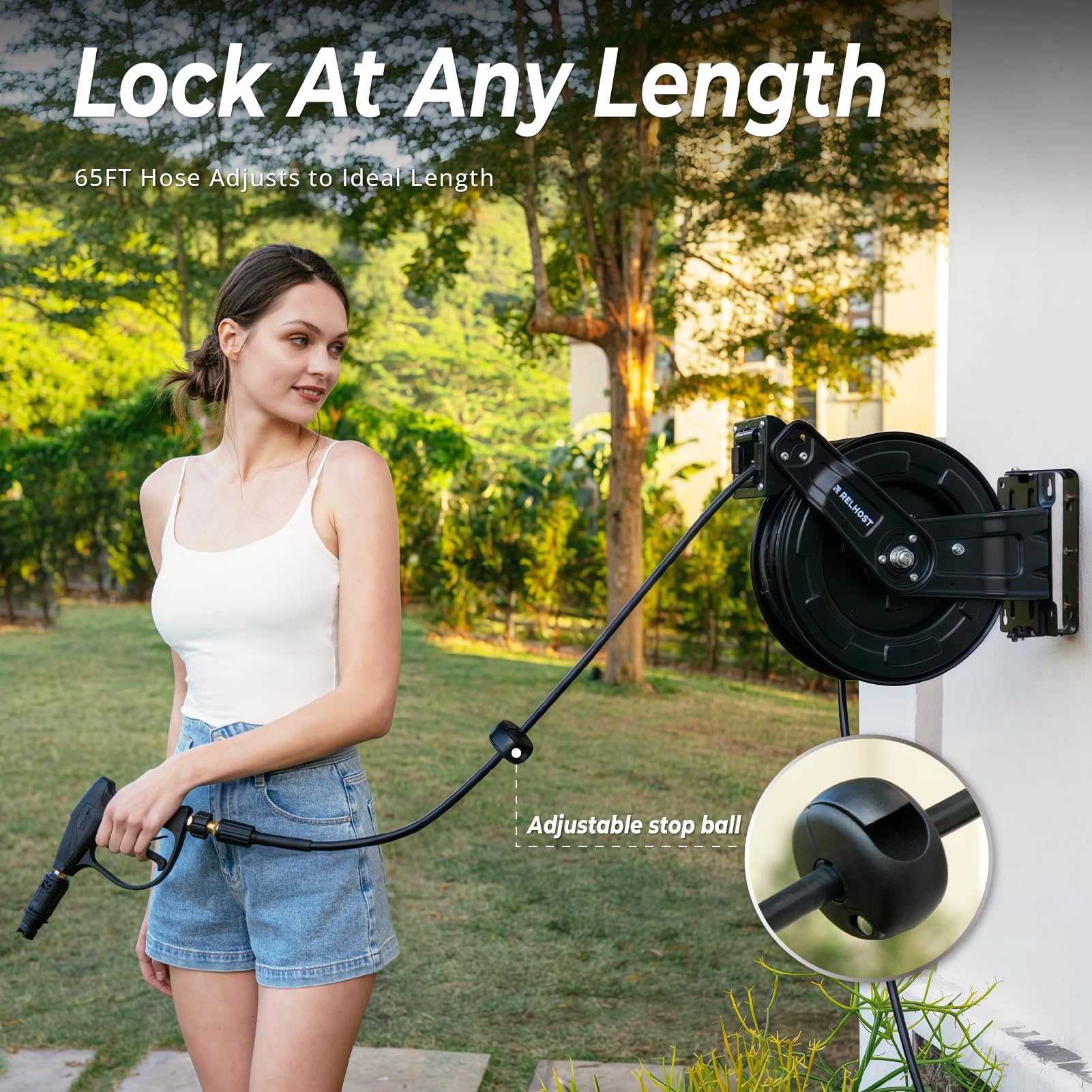 Relhost reel next to a car showing scale and 65 ft reach for vehicle and driveway cleaning