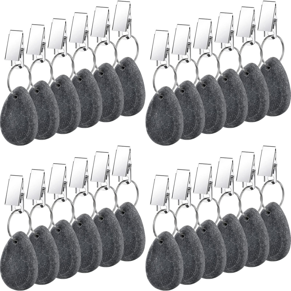 Remagr front view of 24-piece dark gray marble weights showing neat arrangement and compact size benefit