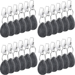 Remagr front view of 24-piece dark gray marble weights showing neat arrangement and compact size benefit
