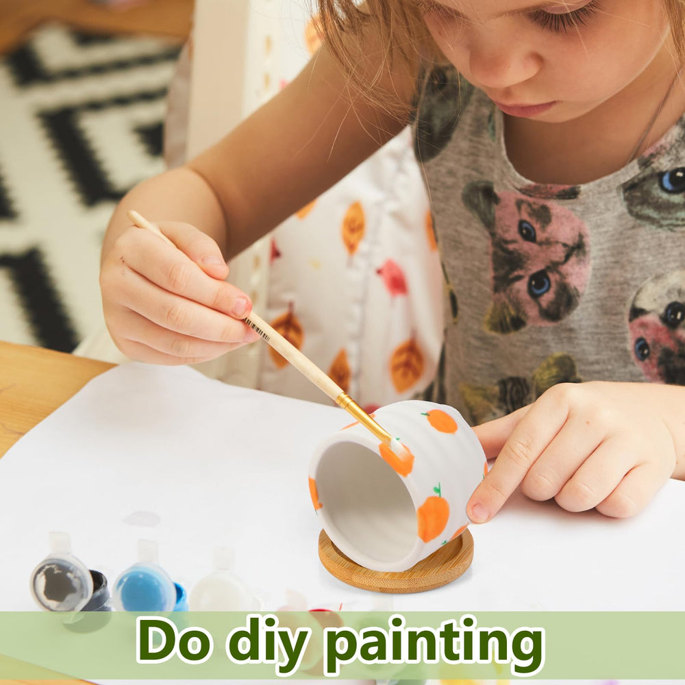 Remerry painted mini planters in varied colors demonstrating DIY customization
