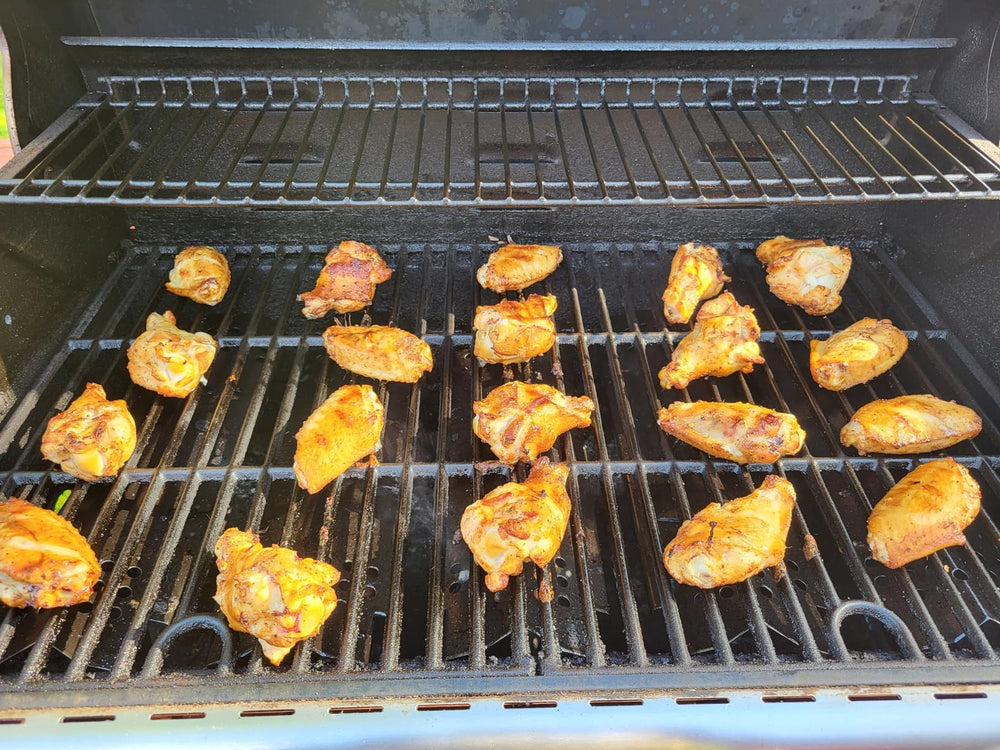 Replace parts heat plates on an outdoor grill in use showing consistent cooking benefit