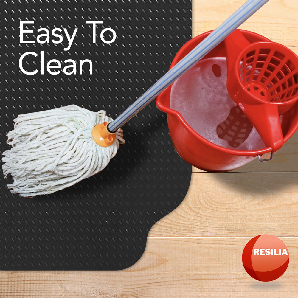 RESILIA mat protecting garage floor under equipment, prevents stains benefit